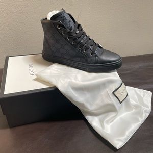 Gucci sneakers, worn once. Comes with box and dust bags can be for women or men.